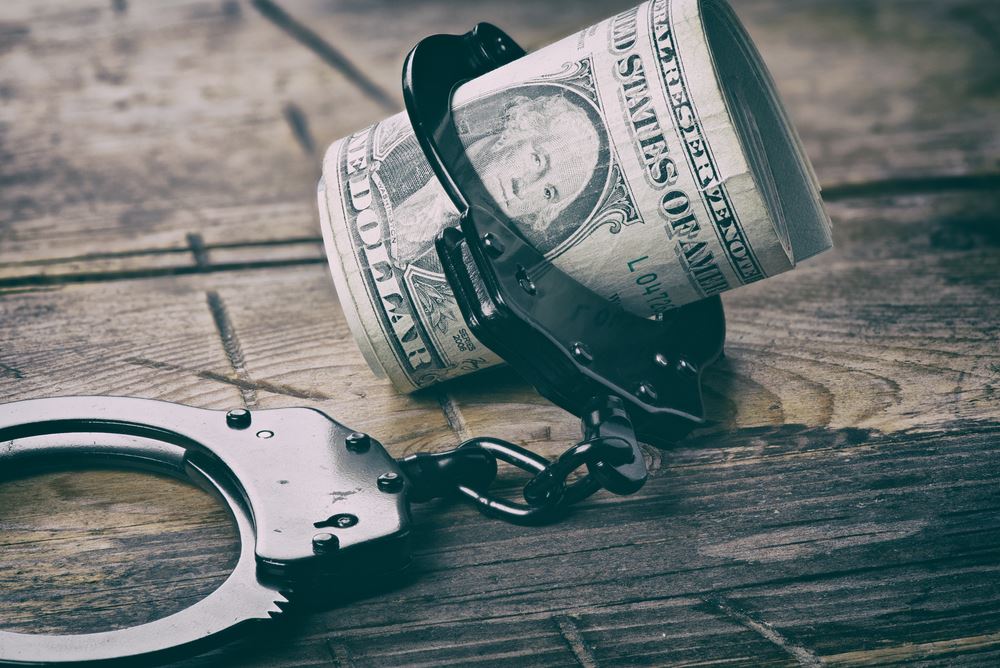 handcuffs and money