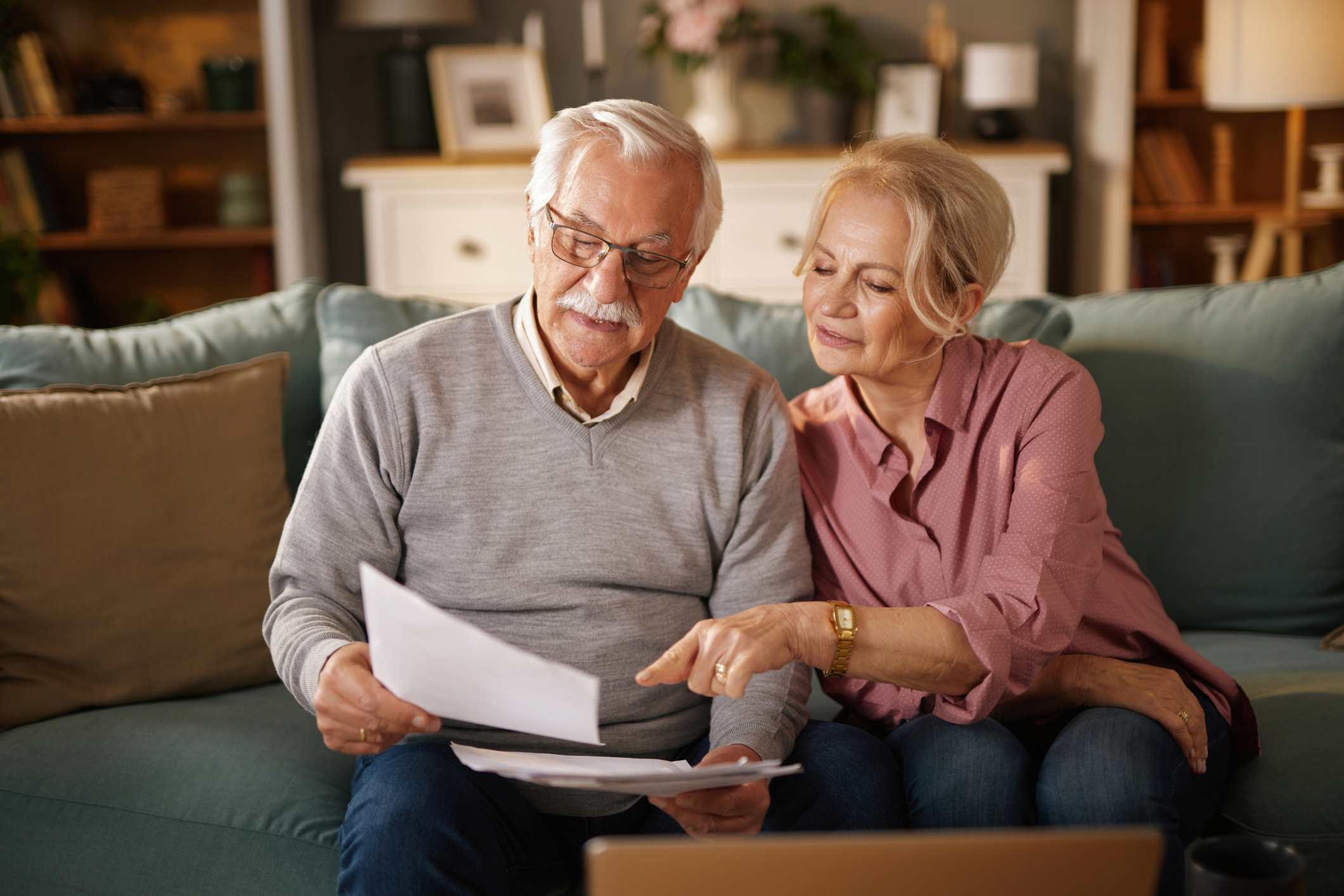 Elderly couple reviewing insurance policy